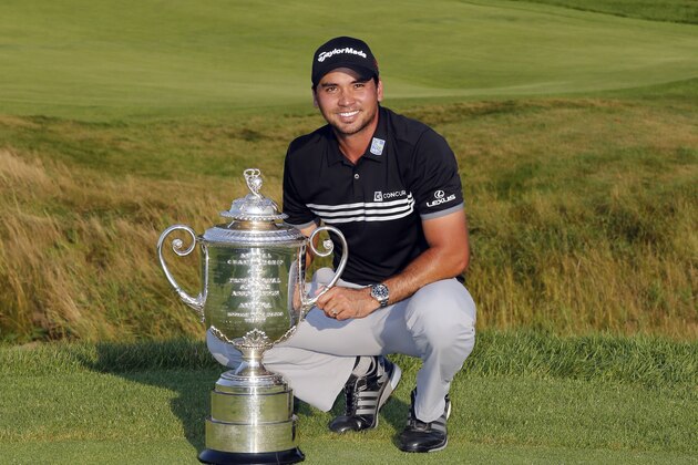 Jason Day, of Australia, poses with the Wanamaker Trophy after winning the PGA Championship golf tournament Sunday, Aug. 16, 2015, at Whistling Straits in Haven, Wis. (AP Photo/Julio Cortez)