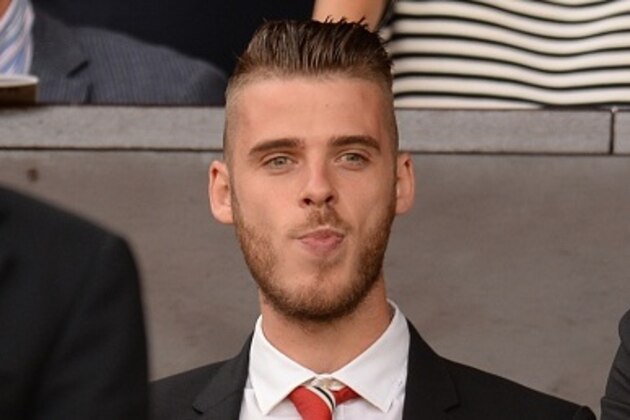 Manchester United's Spanish goalkeeper David de Gea watches from the stands ahead of the English Premier League football match between Manchester United and Tottenham Hotspur at Old Trafford in Manchester, north west England, on August 8, 2015. AFP PHOTO / OLI SCARFF

RESTRICTED TO EDITORIAL USE. No use with unauthorized audio, video, data, fixture lists, club/league logos or 'live' services. Online in-match use limited to 75 images, no video emulation. No use in betting, games or single club/league/player publications.        (Photo credit should read OLI SCARFF/AFP/Getty Images)