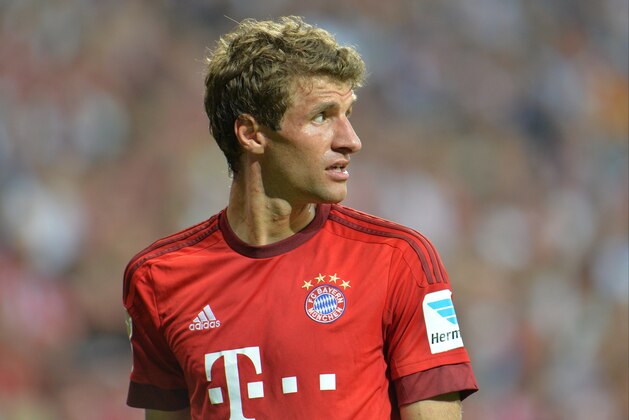 Bayern's Thomas Mueller looks on during the German Bundesliga soccer match between FC Bayern Munich and Hamburger SV in Munich, southern Germany, Friday, Aug. 14, 2015. (AP Photo/Kerstin Joensson)