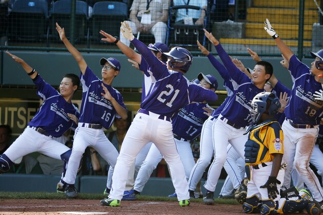 South Korea's Hae Chan Choi (21) celebrates with teammates after hitting a two-run home run off Chicago's Brandon Green in the sixth inning of the Little League World Series championship baseball game in South Williamsport, Pa., Sunday, Aug. 24, 2014. (AP Photo/Gene J. Puskar) South Korea's Hae Chan Choi (21) celebrates with teammates after hitting a two-run home run off Chicago's Brandon Green in the sixth inning of the Little League World Series championship baseball game in South Williamsport, Pa., Sunday, Aug. 24, 2014. (AP Photo/Gene J. Puskar)