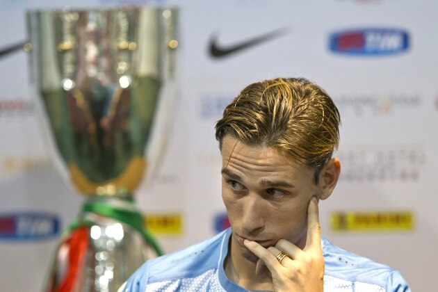 Lazio captain Lucas Biglia attends a press conference ahead of the 2015 TIM Italian Supercup against Juventus at the Shanghai Stadium in Shanghai, Friday, Aug. 7, 2015. (AP Photo/Ng Han Guan)