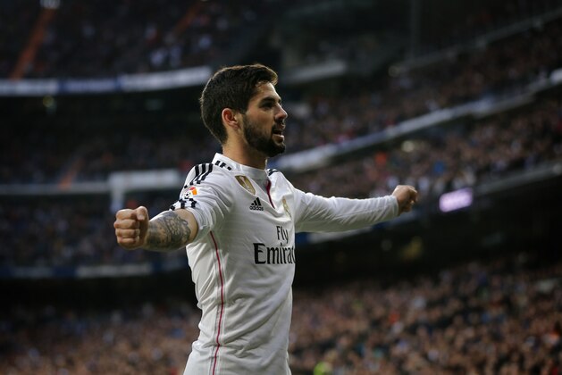 Real Madrid’s Isco, right, celebrates after scoring a goal during a Spanish La Liga soccer match between Real Madrid and Deportivo La Coruna at the Santiago Bernabeu stadium in Madrid, Spain, Saturday, Feb. 14, 2015. (AP Photo/Daniel Ochoa de Olza)