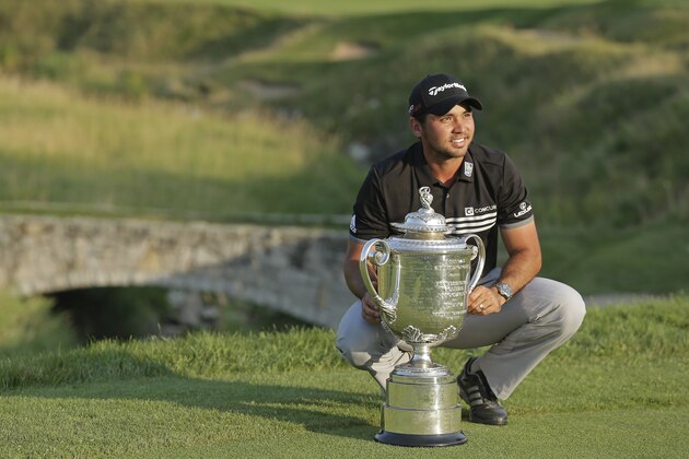 Jason Day, of Australia, poses with the Wanamaker Trophy after winning the PGA Championship golf tournament Sunday, Aug. 16, 2015, at Whistling Straits in Haven, Wis. (AP Photo/Chris Carlson)