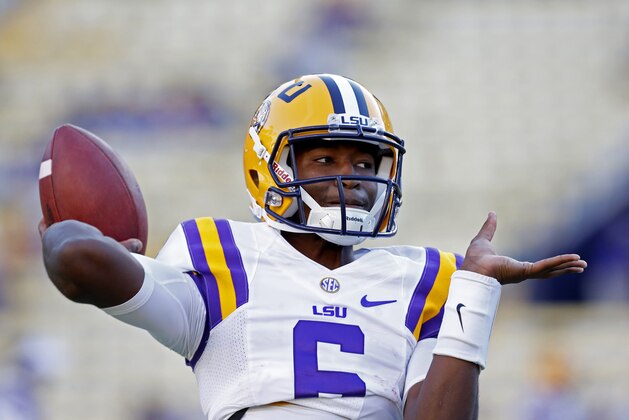LSU quarterback Brandon Harris (6) warms up before an NCAA college football game against Mississippi in Baton Rouge, La., Saturday, Oct. 25, 2014. (AP Photo/Jonathan Bachman)