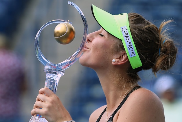TORONTO, ON - AUGUST 16:  Belinda Bencic of Switzerland kisses the championship trophy after defeating Simona Halep of Romania during the finals match on Day 7 of the Rogers Cup at the Aviva Centre on August 16, 2015 in Toronto, Ontario, Canada.  (Photo by Dave Sandford/Getty Images)