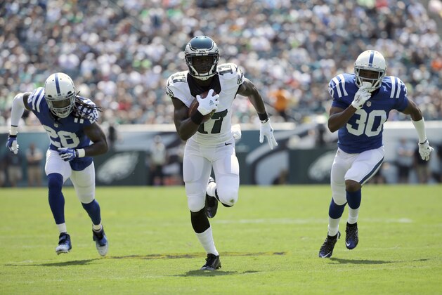 Philadelphia Eagles' Nelson Agholor (17) runs for a touchdown after a catch past Indianapolis Colts' Greg Toler (28) and D'Joun Smith (30) during the first half of a preseason NFL football game against the Indianapolis Colts, Sunday, Aug. 16, 2015, in Philadelphia. (AP Photo/Matt Rourke)