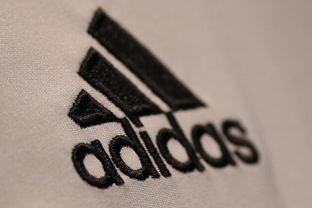 An Adidas logo is seen prior to the German sportswear maker 'Adidas' company's annual statement at it's headquarter in Herzogenaurach, southern Germany, on March 7, 2012.  Adidas said strong demand for its brand pushed it to record earnings in 2011 and it hoped to beat those again this year on the back of the 2012 Olympics. AFP PHOTO / DANIEL ROLAND (Photo credit should read DANIEL ROLAND/AFP/Getty Images)