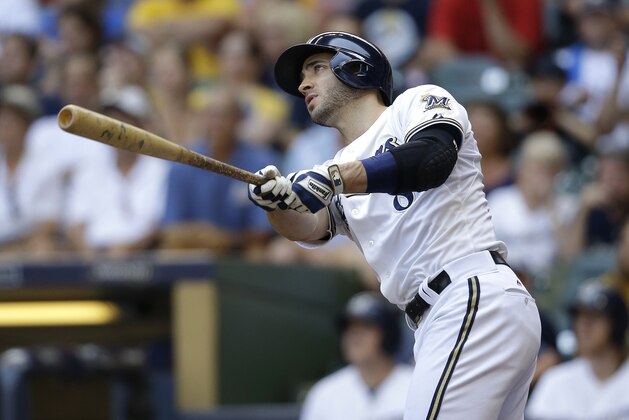 Milwaukee Brewers' Ryan Braun watches his grand slam against the  Philadelphia Phillies during the fifth inning of a baseball game Sunday, Aug. 16, 2015, in Milwaukee. (AP Photo/Jeffrey Phelps)