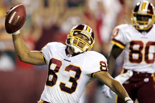 Washington Redskins wide reciever James Thrash (83) spikes the ball after scoring a first-quarter touchdown against the Cincinnati Bengals in a preseason game Friday, Aug. 19, 2005, in Landover, Md. At right is Redskins receiver David Patten. (AP Photo/Evan Vucci)
