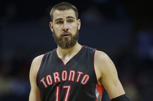 Toronto Raptors center Jonas Valanciunas, of Lithuania, during a break in the action as the Raptors play the Charlotte Hornets in an NBA basketball game Wednesday, April 8, 2015 in Charlotte, N.C. Toronto won 92-74. (AP Photo/Nell Redmond)