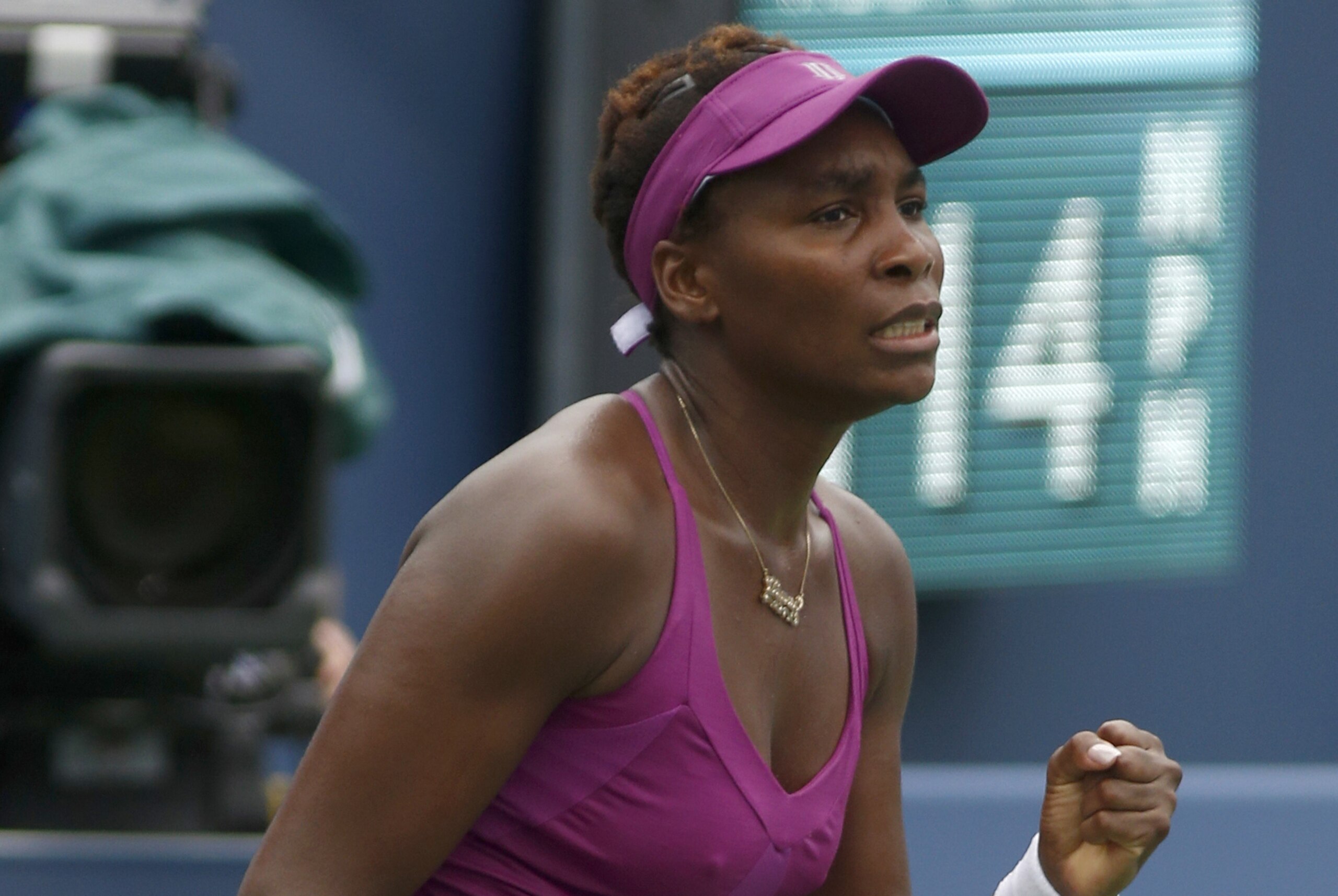 Venus Williams, of the United States, reacts during a first round match with Zarina Diyas, of Kazakhstan, at the Western & Southern Open tennis tournament, Monday, Aug. 17, 2015, in Mason, Ohio. (AP Photo/David Kohl)