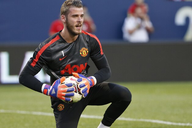 Manchester United goalkeeper David De Gea warms up before an International Champions Cup soccer match against Paris Saint-Germain on Wednesday, July 29, 2015, in Chicago. (AP Photo/Kamil Krzaczynski)