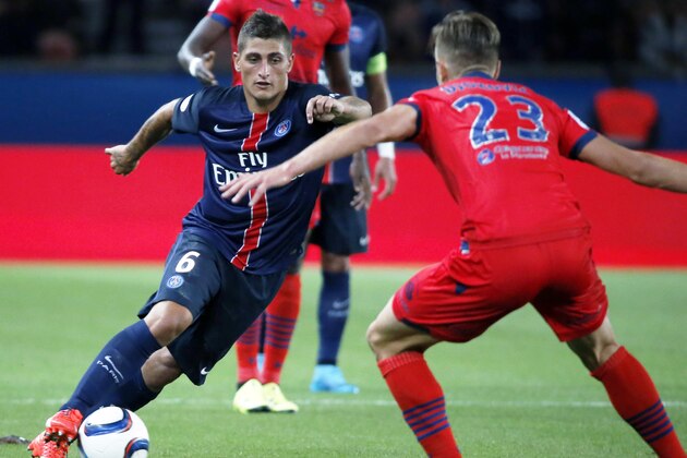 Paris Saint Germain's Marco Verratti, left  challenges for the ball with Damjan Dokovic of Ajaccio Gazelec during the French League one soccer match between Paris Saint Germain and Ajaccio Gazelec,  at the Parc des Princes stadium in Paris, France. Sunday, Aug. 16, 2015.  (AP Photo/Jacques Brinon)