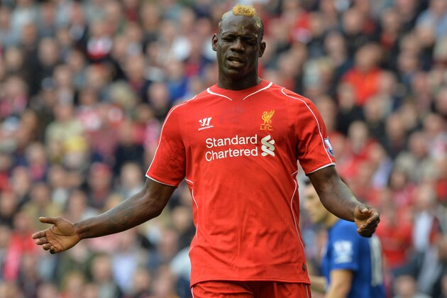 Liverpool's Italian striker Mario Balotelli reacts after a missed opportunity at goal during the English Premier League football match between Liverpool and Everton at the Anfield stadium in Liverpool on September 27, 2014.  AFP PHOTO/PAUL ELLIS - RESTRICTED TO EDITORIAL USE. No use with unauthorized audio, video, data, fixture lists, club/league logos or live services. Online in-match use limited to 45 images, no video emulation. No use in betting, games or single club/league/player publications.        (Photo credit should read PAUL ELLIS/AFP/Getty Images)