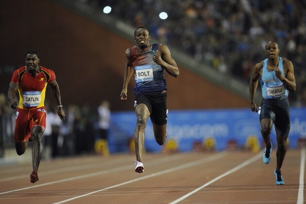 (From L-R) US athlete Justin Gatlin, Jamaica's Usain Bolt, and Britain James Dasaolu compete during the men's 100m race at the Diamond League athletics meeting on September 6, 2013, in Brussels. AFP PHOTO / JOHN THYS        (Photo credit should read JOHN THYS/AFP/Getty Images)