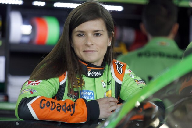 Danica Patrick waits by her car before practice for Sunday's NASCAR Coca-Cola 600 Sprint Cup series auto race at Charlotte Motor Speedway in Concord, N.C., Saturday, May 23, 2015. (AP Photo/Chris Keane)