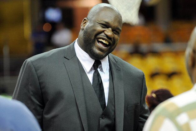 May 26, 2015; Cleveland, OH, USA; TNT analyst Shaquille O'Neal laughs on the court before game four of the Eastern Conference Finals of the NBA Playoffs between the Cleveland Cavaliers and the Atlanta Hawks at Quicken Loans Arena. Mandatory Credit: Ken Blaze-USA TODAY Sports