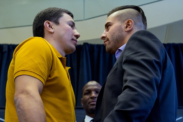Middleweight boxers Gennady Golovkin, left, of Kazakhstan, and David Lemieux, of Canada,  pose together during a news conference Tuesday, Aug. 18, 2015, in New York, to promote their middleweight world championship title unification bout set for Saturday, Oct. 17, 2015, at Madison Square Garden. At rear center is boxer Bernard Hopkins. (AP Photo/Craig Ruttle)