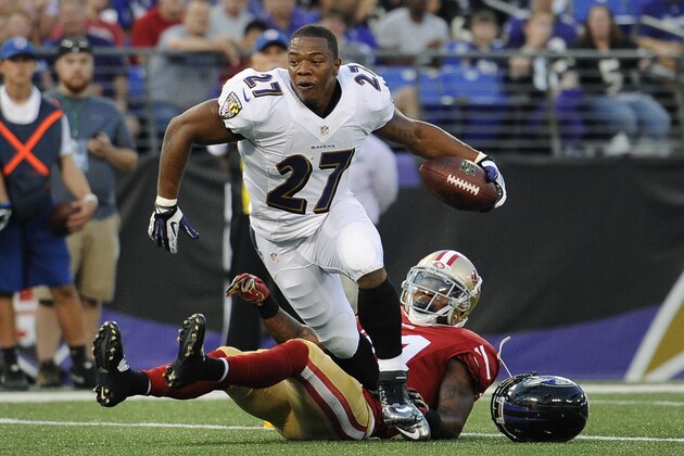 Baltimore Ravens running back Ray Rice (27) runs toward the end zone past San Francisco 49ers strong safety Antoine Bethea in the first half of an NFL preseason football game, Thursday, Aug. 7, 2014, in Baltimore. Rice did not score as the play was called dead after he lost his helmet. (AP Photo/Nick Wass)