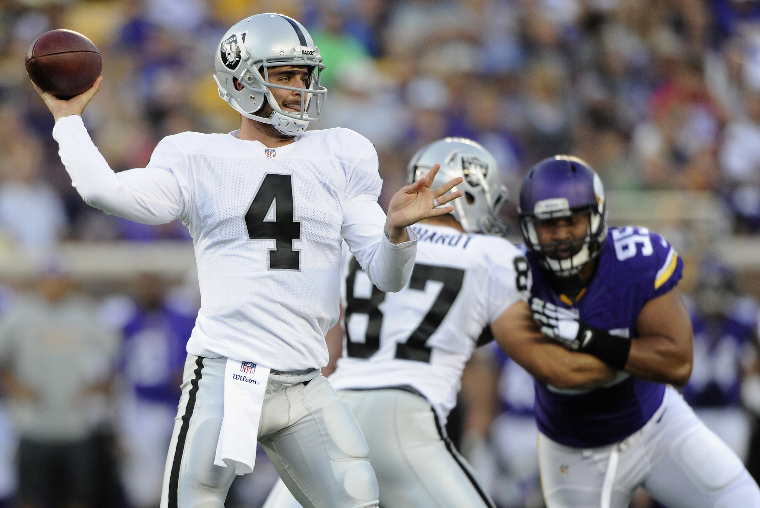 MINNEAPOLIS, MN - AUGUST 8: Derek Carr #4 of the Oakland Raiders passes the ball during the second quarter of the game against the Minnesota Vikings on August 8, 2014 at TCF Bank Stadium in Minneapolis, Minnesota. (Photo by Hannah Foslien/Getty Images)