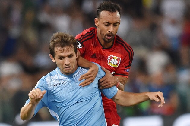 ROME, ITALY - AUGUST 18:  Senad Lulic of SS Lazio and Karim Bellarabi of Bayer Leverkusen in action during the UEFA Champions League qualifying round play off first leg match between SS Lazio and Bayer Leverkusen at Olimpico Stadium on August 18, 2015 in Rome, Italy.  (Photo by Giuseppe Bellini/Getty Images)