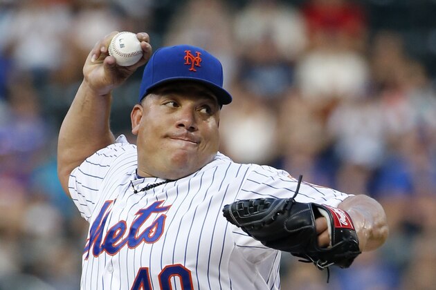 New York Mets starting pitcher Bartolo Colon (40) winds up in a baseball game against the San Diego Padres in New York, Wednesday, July 29, 2015. (AP Photo/Kathy Willens)