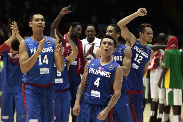 Philippines' Japeth Aguilar, left, and teammate Jim Alapag, right, celebrates after winning the match at the end of the match  against Senegal during the Group B Basketball World Cup match between the Philippines and Senegal in Seville, Spain, Thursday, Sept. 4, 2014. The 2014 Basketball World Cup competition will take place in various cities in Spain from Aug. 30 through to Sept. 14. (AP Photo/Miguel Angel Morenatti)