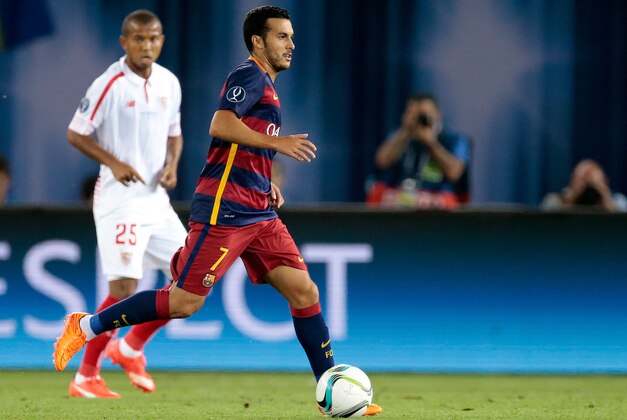 Barcelona's Pedro Rodriguez runs with the ball during the UEFA Super Cup soccer match between FC Barcelona and Sevilla FC at the Boris Paichadze Dinamo Arena stadium, in Tbilisi, Georgia, on Wednesday, Aug. 12, 2015. (AP Photo/Ivan Sekretarev)