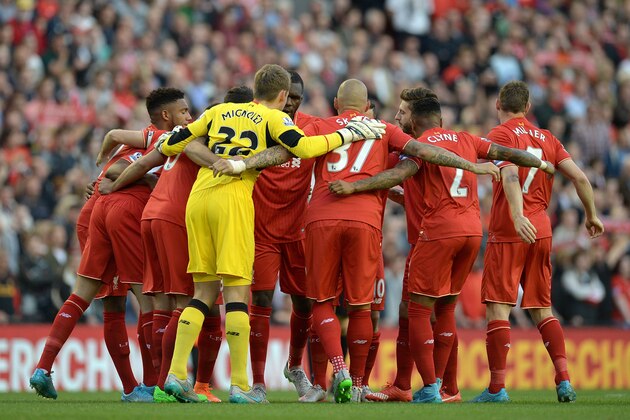 The Liverpool team form a huddle before the start of the English Premier League football match between Liverpool and Bournemouth at the Anfield stadium in Liverpool, north-west England on August 17, 2015. AFP PHOTO / OLI SCARFF

RESTRICTED TO EDITORIAL USE. No use with unauthorized audio, video, data, fixture lists, club/league logos or 'live' services. Online in-match use limited to 75 images, no video emulation. No use in betting, games or single club/league/player publications.        (Photo credit should read OLI SCARFF/AFP/Getty Images)