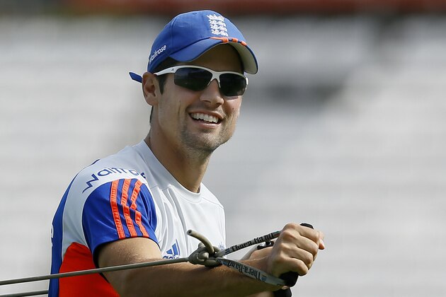 England's captain Alastair Cook smiles as he stretches during a training session at the Oval cricket ground in London, Wednesday, Aug. 19, 2015. The fifth test starts at the ground on Thursday. (AP Photo/Kirsty Wigglesworth)