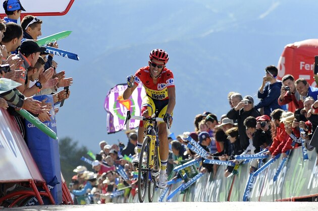 Alberto Contador of Spain wins the 20th stage of the Spanish Vuelta cycling, a 185.7-kilometer (115-mile) ride between Santo Estevo De Ribas De Sil and Puerto De Ancares, Spain, Saturday, Sept. 13, 2014. Contador won the 20th stage of the Spanish Vuelta Saturday and consolidated his leadership. The 21-stage race ends tomorrow, Sept. 14, in Santiago de Compostela. (AP Photo/Paulo Duarte)