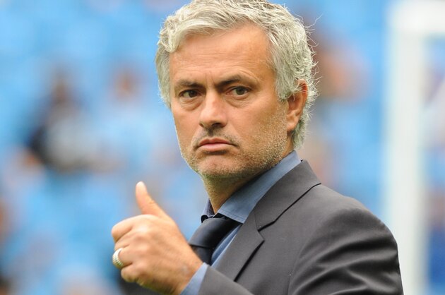 Chelsea manager Jose Mourinho gestures as he stands on the pitch prior to the start of the English Premier League soccer match between Manchester City and Chelsea at Etihad stadium, Manchester, England, Sunday, Aug. 16, 2015. (AP Photo/Rui Vieira)