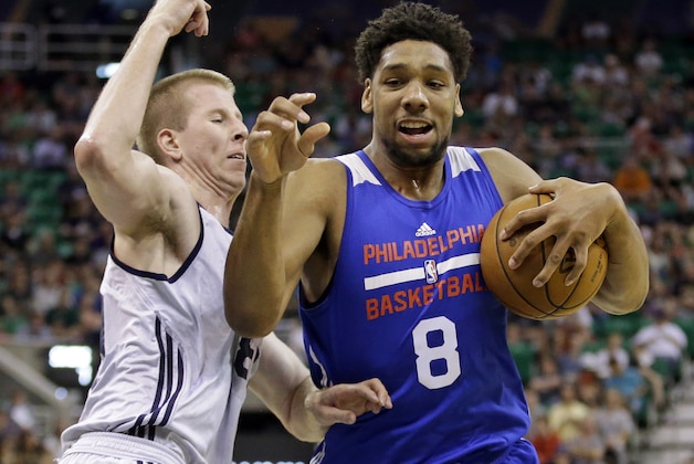 Philadelphia 76ers' Jahlil Okafor (8) drives to the basket as Utah Jazz's Brock Motum, left, defends during the first half of an NBA summer league basketball game Thursday, July 9, 2015, in Salt Lake City. (AP Photo/Rick Bowmer)