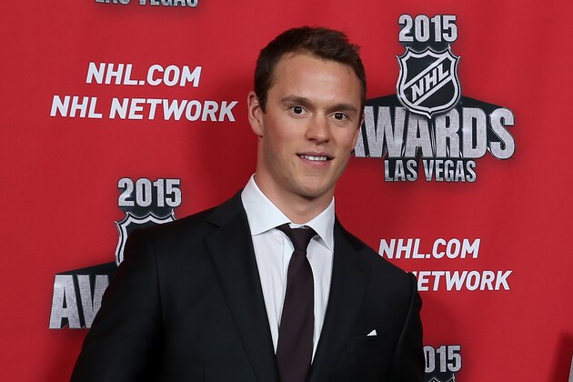 LAS VEGAS, NV - JUNE 24:  Jonathan Toews of the Chicago Blackhawks poses in the press room with the new cover for EA Sports NHL '16 at the 2015 NHL Awards at MGM Grand Garden Arena on June 24, 2015 in Las Vegas, Nevada.  (Photo by Bruce Bennett/Getty Images)