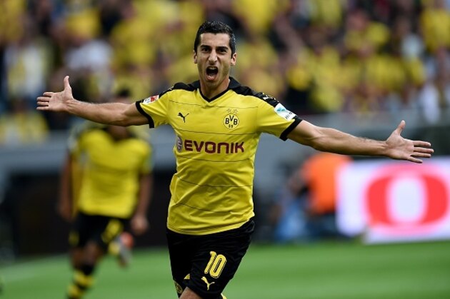 Dortmund's Armenian midfielder Henrikh Mkhitaryan reacts during the German first division Bundesliga football match Borussia Dortmund vs Borussia Moenchengladbach in Dortmund, western Germany, on August 15, 2015.  AFP PHOTO / PATRIK STOLLARZRESTRICTIONS: DURING MATCH TIME: DFL RULES TO LIMIT THE ONLINE USAGE TO 15 PICTURES PER MATCH AND FORBID IMAGE SEQUENCES TO SIMULATE VIDEO. == RESTRICTED TO EDITORIAL USE ==FOR FURTHER QUERIES PLEASE CONTACT DFL DIRECTLY AT   49 69 650050.        (Photo credit should read PATRIK STOLLARZ/AFP/Getty Images)