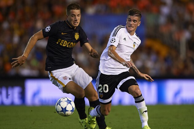 VALENCIA, SPAIN - AUGUST 19:  Rodrigo De Paul (R) of Valencia battle for the ball with Mario Pasalic of Monaco during the UEFA Champions League Qualifying Round Play Off First Leg match between Valencia CF and AS Monaco at Mestalla Stadium on August 19, 2015 in Valencia, Spain.  (Photo by Manuel Queimadelos Alonso/Getty Images)