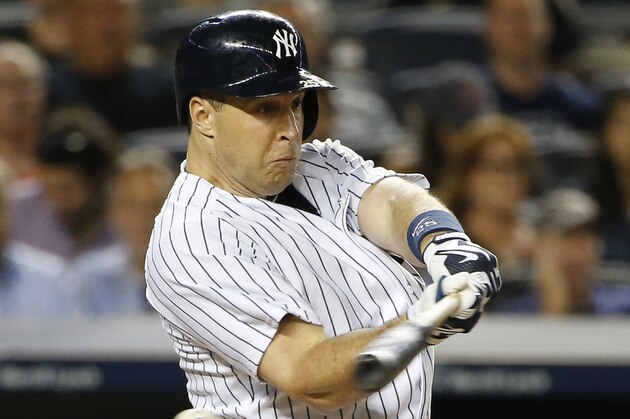 New York Yankees' Mark Teixeira misses on a pitch from Boston Red Sox starting pitcher Steven Wright in the sixth inning of a baseball game at Yankee Stadium in New York, Wednesday, Aug. 5, 2015.  (AP Photo/Kathy Willens)