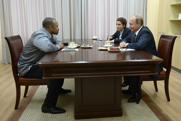 Russian President Vladimir Putin, right, meets with American boxer Roy Jones Jr. in Sevastopol, Crimea, Wednesday, Aug. 19, 2015. (Alexei Nikolsky/RIA-Novosti, Kremlin Pool Photo via AP)