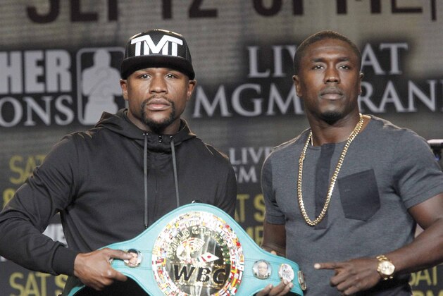 Floyd Mayweather Jr., left, and Andre Berto pose at a news conference in Los Angeles on Thursday, Aug. 6, 2015. Mayweather says Berto is a worthy opponent for the final fight of his perfect career. (AP Photo/Nick Ut)