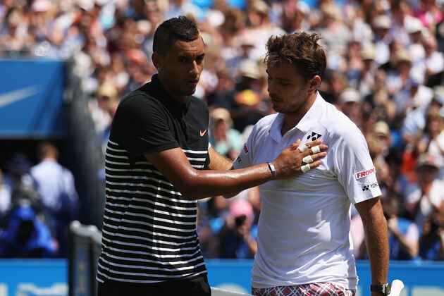 LONDON, ENGLAND - JUNE 16:  Stanislas Wawrinka (R) of Switzerland shakes hands with Nick Kyrgios of Australia after his victory in their men's singles first round match during day two of the Aegon Championships at Queen's Club on June 16, 2015 in London, England.  (Photo by Clive Brunskill/Getty Images)