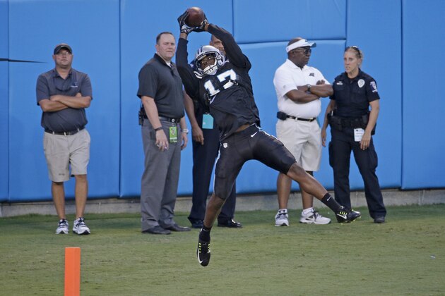 Carolina Panthers' Devin Funchess (17) catches a pass during the annual Fan Fest at the NFL football team's training camp in Charlotte, N.C., Friday, Aug. 7, 2015. (AP Photo/Chuck Burton)