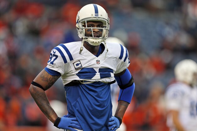 FILE - In this Jan. 11, 2015, file photo, Indianapolis Colts wide receiver Reggie Wayne warms up for the NFL divisional playoff football game against the Denver Broncos in Denver. The NFL is a young man's game, but from Julius Peppers to Reggie Wayne there are a handful of thirtysomethings still capable of a meaningful contribution for their respective teams in the Super Bowl semifinals this Sunday. (AP Photo/Joe Mahoney, File)