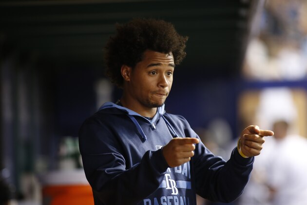ST. PETERSBURG, FL - AUGUST 7:  Pitcher Chris Archer #22 of the Tampa Bay Rays gestures as he speaks with teammates in the dugout during the fifth inning of a game against the New York Mets on August 7, 2015 at Tropicana Field in St. Petersburg, Florida.  (Photo by Brian Blanco/Getty Images)