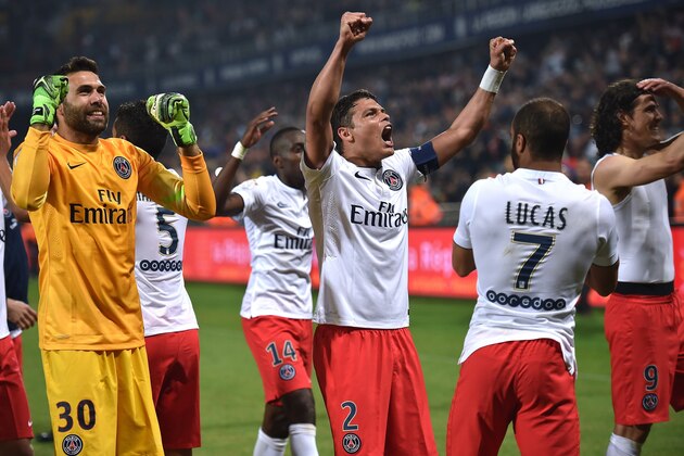 Paris Saint-Germain's players react after winning the French L1 football match between Montpellier and Paris Saint Germain (PSG), on May 16, 2015 at the La Mosson Stadium in Montpellier, southern France.   AFP PHOTO / PASCAL GUYOT        (Photo credit should read PASCAL GUYOT/AFP/Getty Images)