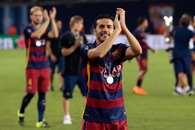 Barcelona's Pedro Rodriguez applauds the supporters after winning the UEFA Super Cup soccer match between FC Barcelona and Sevilla FC at the Boris Paichadze Dinamo Arena stadium, in Tbilisi, Georgia, on Wednesday, Aug. 12, 2015. Barcelona won 5-4. (AP Photo/Ivan Sekretarev)