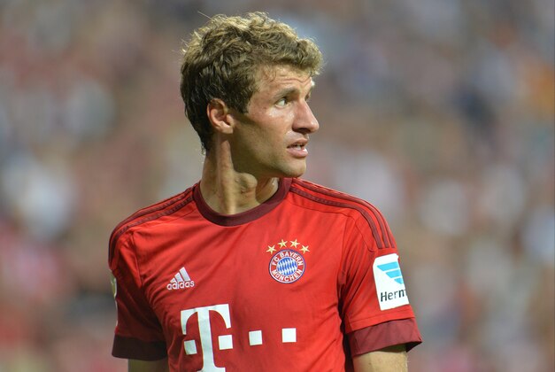 Bayern's Thomas Mueller looks on during the German Bundesliga soccer match between FC Bayern Munich and Hamburger SV in Munich, southern Germany, Friday, Aug. 14, 2015. (AP Photo/Kerstin Joensson)