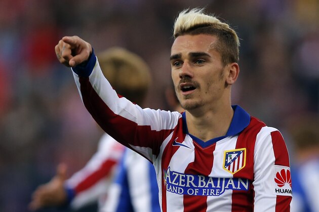 Antoine Griezmann from France points during a Spanish La Liga soccer match between Atletico de Madrid and Real Sociedad at the Vicente Calderon stadium in Madrid, Spain, Tuesday, April 7, 2015. (AP Photo/Daniel Ochoa de Olza)