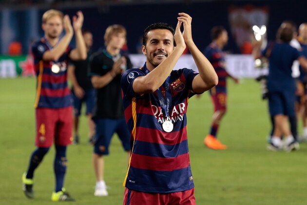 Barcelona's Pedro Rodriguez applauds the supporters after winning the UEFA Super Cup soccer match between FC Barcelona and Sevilla FC at the Boris Paichadze Dinamo Arena stadium, in Tbilisi, Georgia, on Wednesday, Aug. 12, 2015. Barcelona won 5-4. (AP Photo/Ivan Sekretarev)
