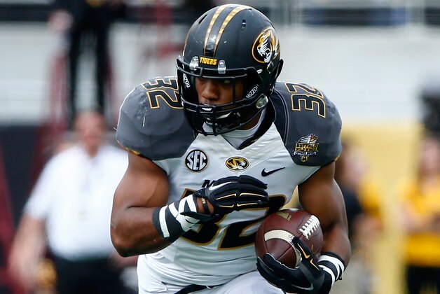 ORLANDO, FL - JANUARY 01:  Russell Hansbrough #32 of the Missouri Tigers runs for yardage during the Buffalo Wild Wings Citrus Bowl against the Minnesota Golden Gophers at the Florida Citrus Bowl on January 1, 2015 in Orlando, Florida.  (Photo by Sam Greenwood/Getty Images)