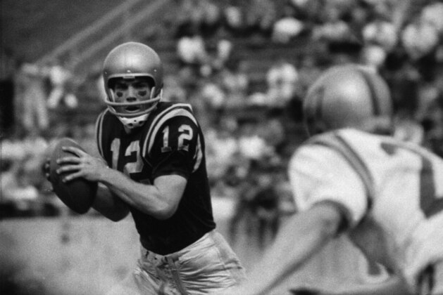 Roger Staubach (12) passing in Navy football game 1963. (AP Photo)